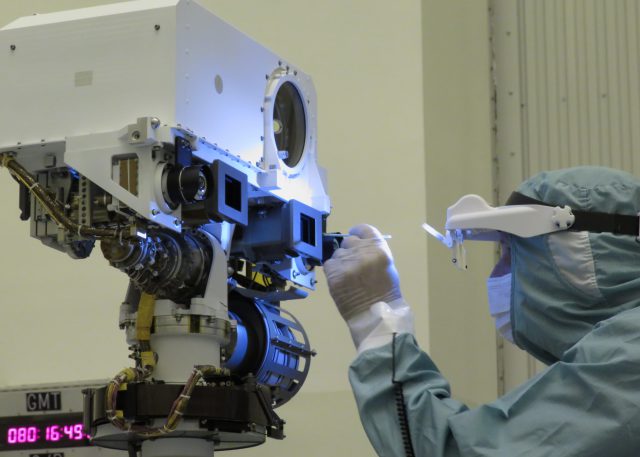JPL optical technician Jerry Mulder performs a final inspection and swab cleaning of the front optics of the Mars 2020 mission’s Perseverance rover Mastcam-Z cameras at the Kennedy Space Center in March, 2020.